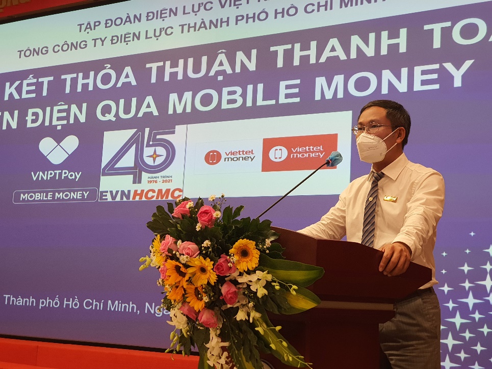 EVNHCMC ký kết thanh toán tiền điện không dùng tiền mặt qua Mobile Money - Ảnh 1.