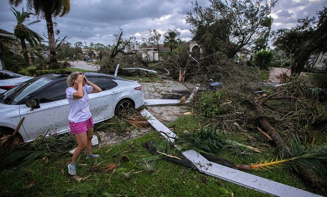 Marie Cook reacts to the damage to her home in the Binks Estates community after a tornado touch down around 5:30pm striking homes in The Preserve and Binks Estate among others in its path on Oct. 9, 2024 in Wellington, Florida, before Hurricane Milton made landfall.