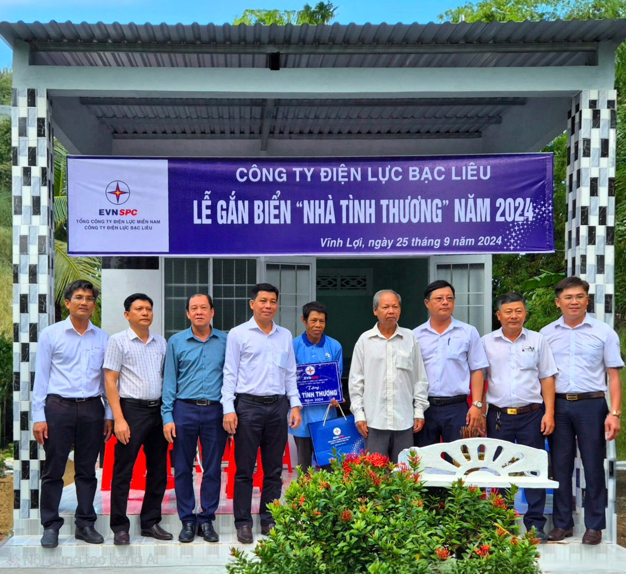 A group of people standing in front of a banner Description automatically generated