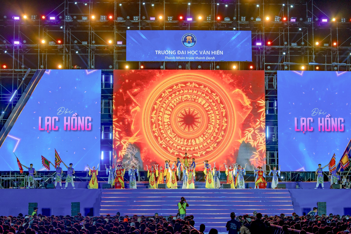 A group of people on a stage Description automatically generated
