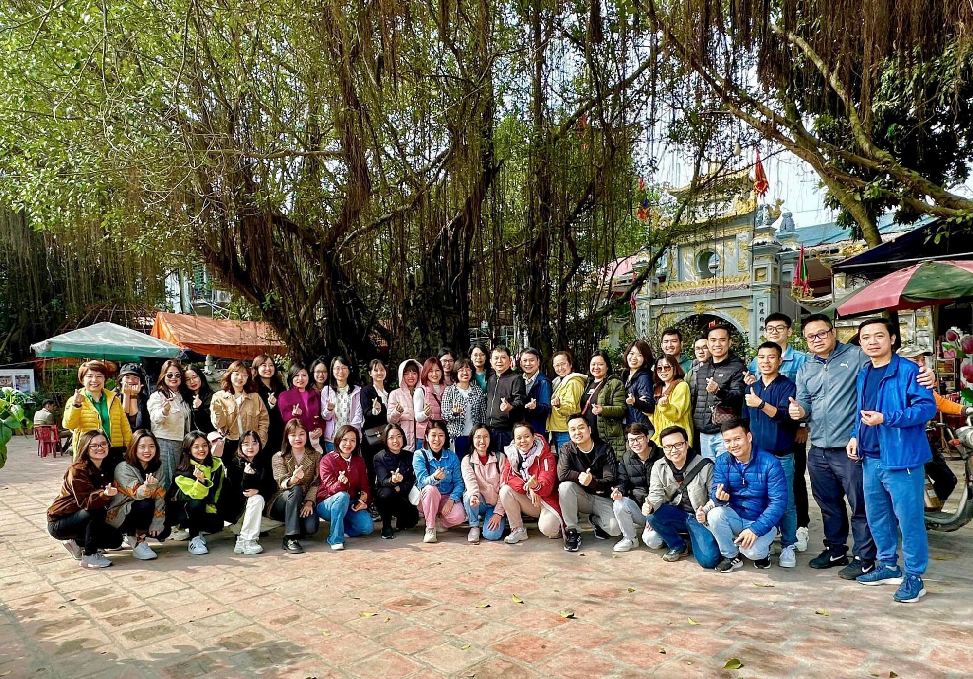 A group of people posing for a photo Description automatically generated