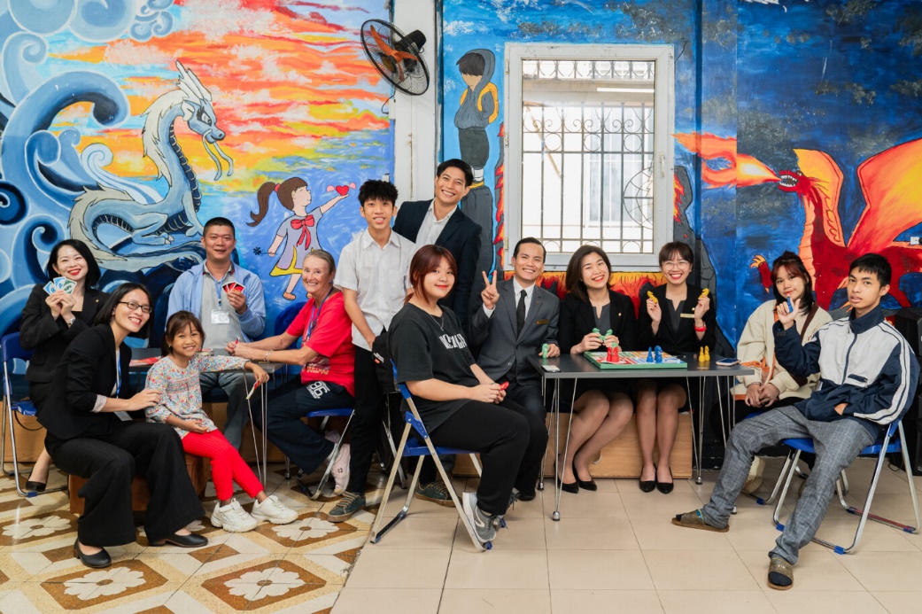 A group of people posing for a photo  Description automatically generated