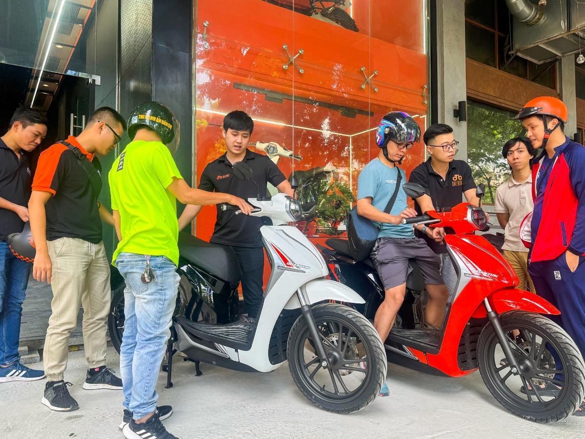 May be an image of 8 people, segway, motorcycle, scooter and text