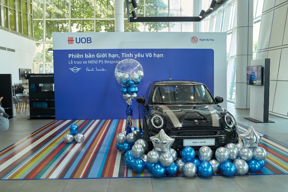 A car with balloons and a balloon on the floor Description automatically generated