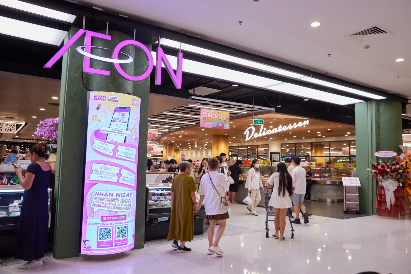 People in a mall with a sign  Description automatically generated with medium confidence