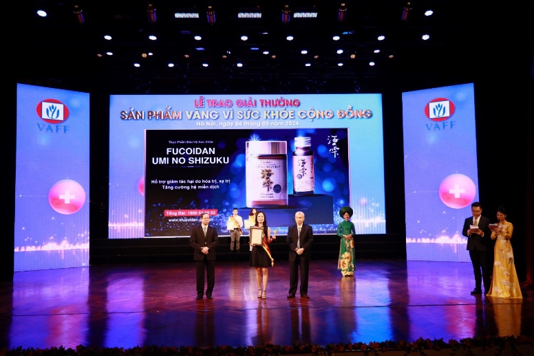A group of people on a stage Description automatically generated