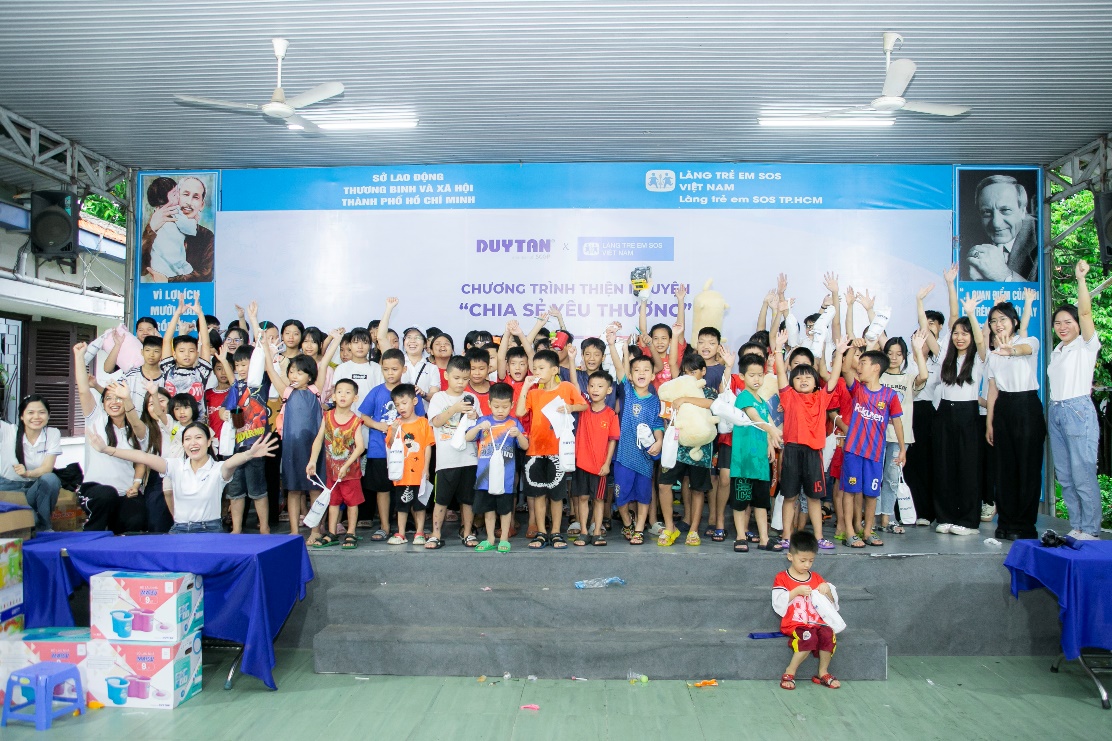 A group of children on a stage Description automatically generated