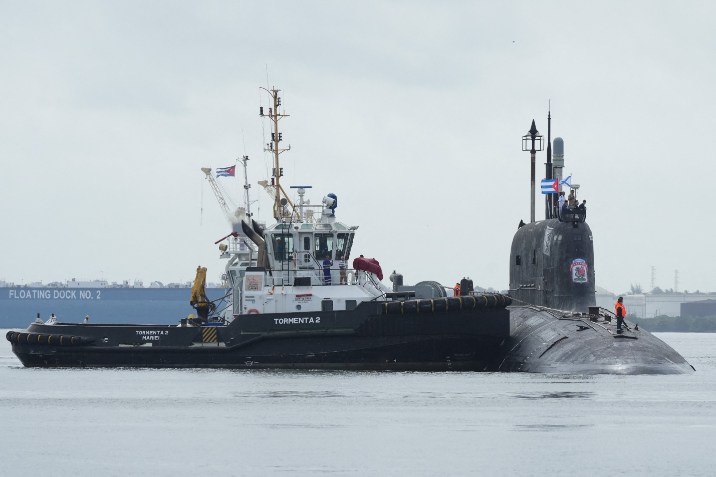 PHOTO: A tug boat manoeuvres Russian nuclear-powered cruise missile submarine Kazan as it docks in Havana's bay, Cuba, June 12, 2024. 
