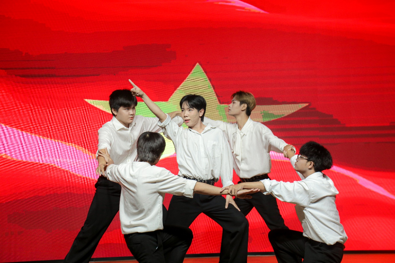 A group of men in white shirts Description automatically generated