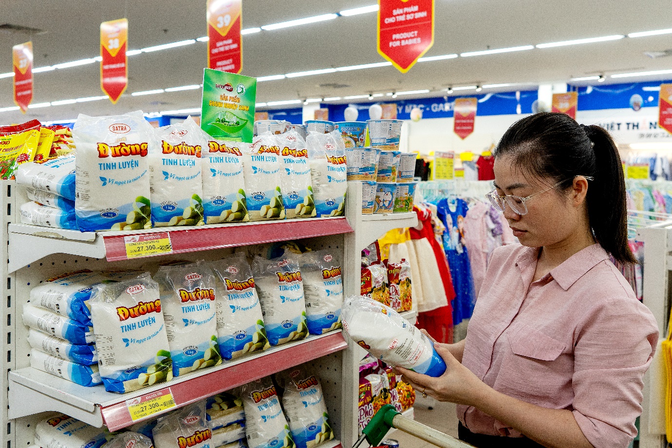A person looking at a product in a store Description automatically generated