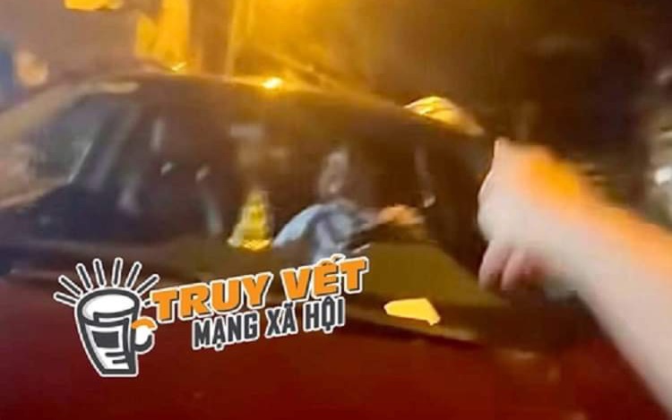 Sự thật về clip người đàn ông chạy ô tô trên nắp capo có một phụ nữ
