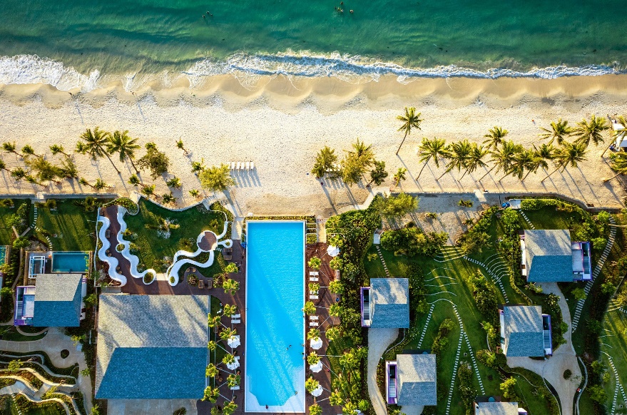 A swimming pool on a beach Description automatically generated