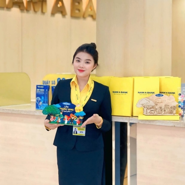 A person in a uniform holding a toy Description automatically generated