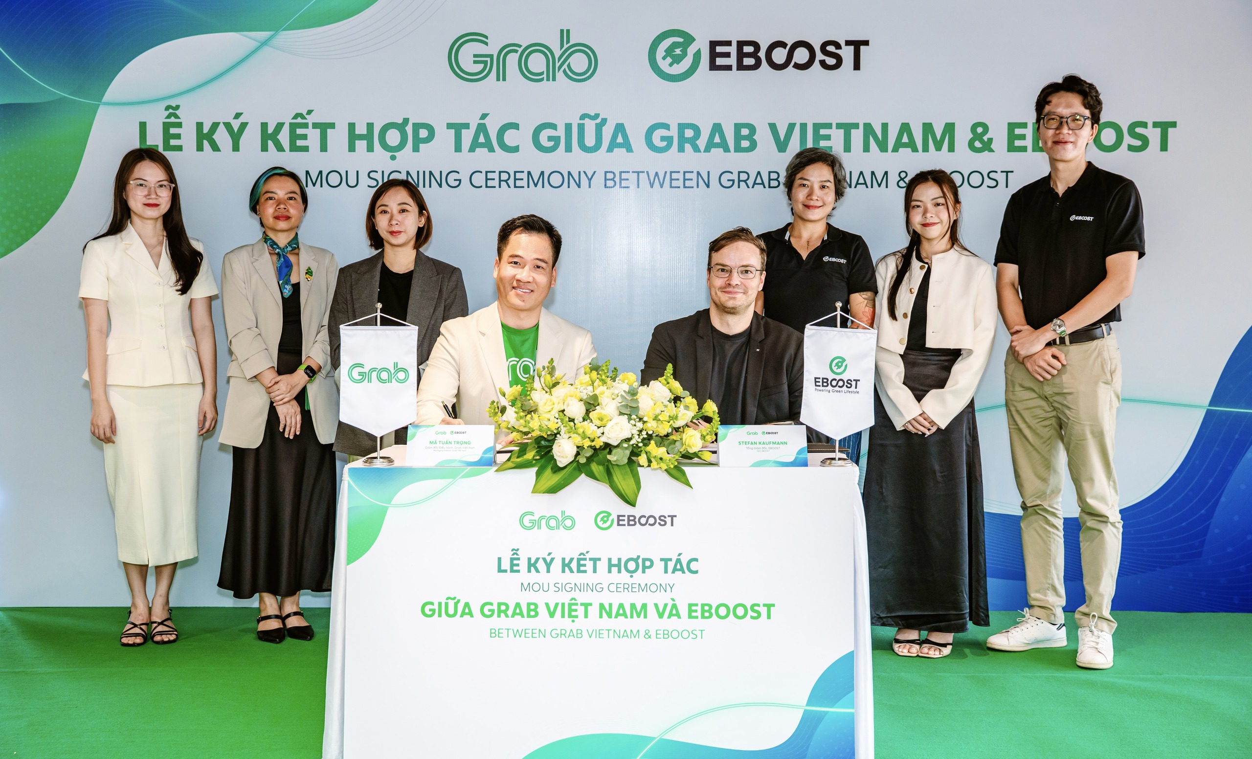 Grab Việt Nam hợp t&aacute;c với EBOOST th&uacute;c đẩy sử dụng xe điện - Ảnh 1.