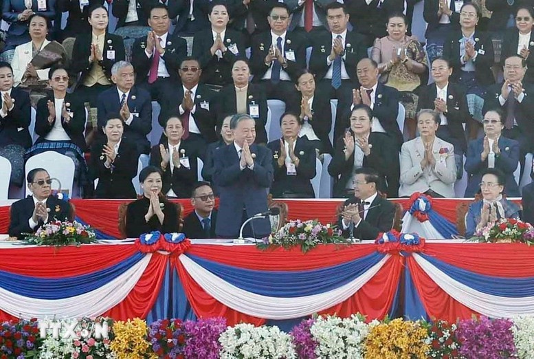 Tổng Bí thư Tô Lâm và Phu nhân dự Lễ kỷ niệm 50 năm Quốc khánh Lào - Ảnh 1.