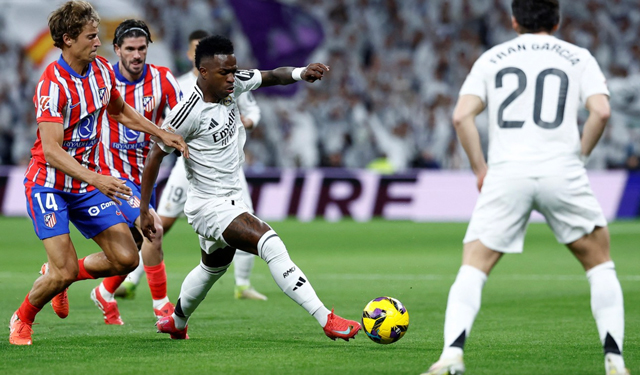 Atletico kh&oacute; cản bước l&aacute;ng giềng Real Madrid ở lần t&aacute;i đấu Ảnh: OLEUSA
