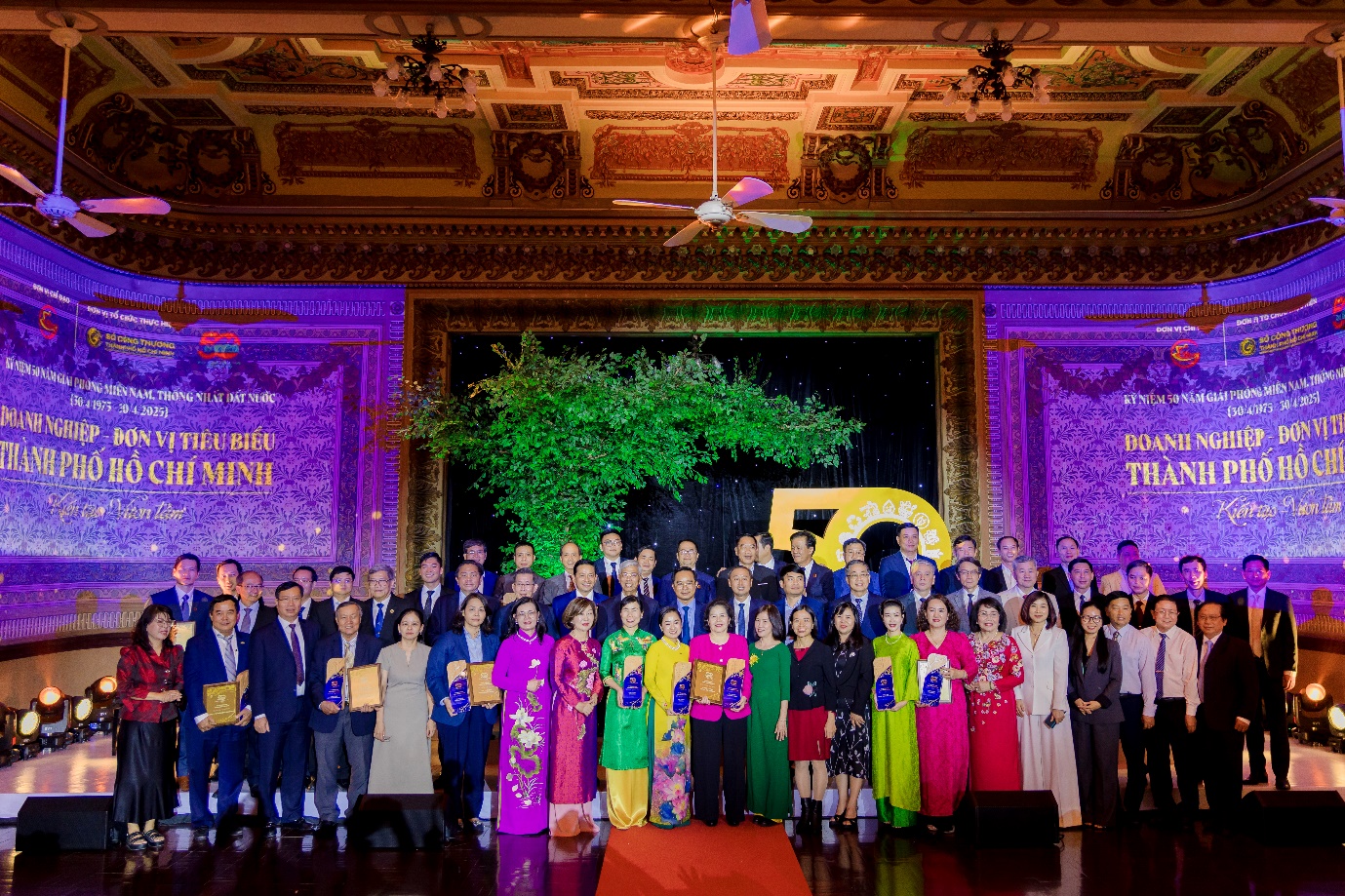A group of people standing in front of a stage AI-generated content may be incorrect.