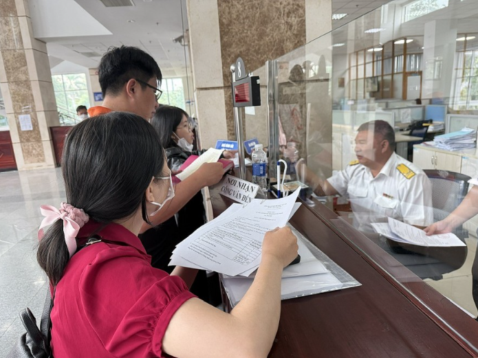 Ngành thuế TP HCM sẽ lập đường dây nóng hỗ trợ hộ kinh doanh - Ảnh 1.