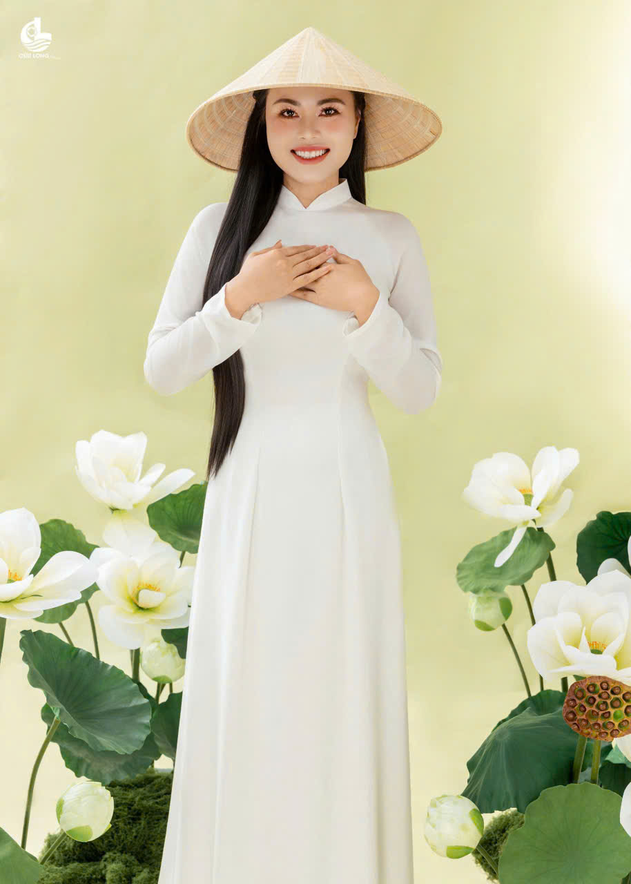 Hoa hậu Dạ Minh Ch&acirc;u khoe sắc trong t&agrave; &aacute;o d&agrave;i đ&oacute;n 8 th&aacute;ng 3 - Ảnh 1.