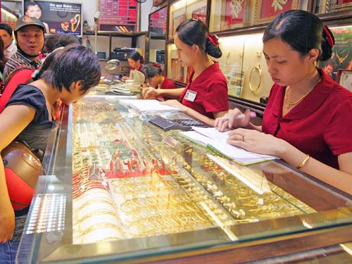 Vàng giảm, USD bất ngờ tăng giá