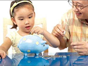 Lúng túng khi dạy con dùng tiền