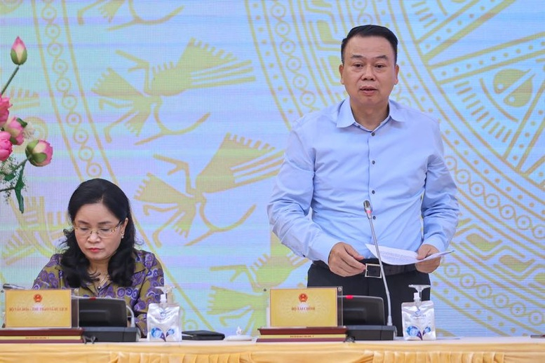 Thứ trưởng Bộ T&agrave;i ch&iacute;nh Nguyễn Đức Chi trả lời c&acirc;u hỏi của ph&oacute;ng vi&ecirc;n về th&iacute; điểm giao dịch t&agrave;i sản m&atilde; h&oacute;a (Ảnh: Nhật Bắc)