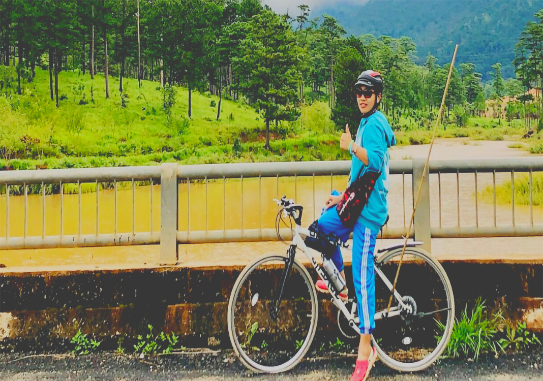 Female cyclist on trans-Vietnam route