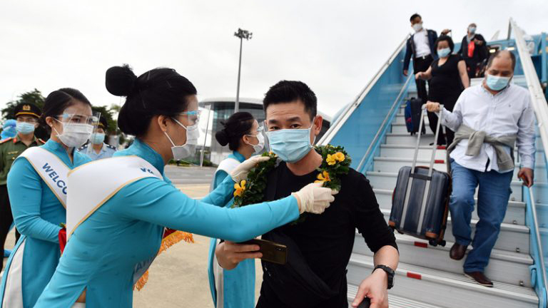 Vietnam lifts centralized quarantine for fully-vaxxed arrivals