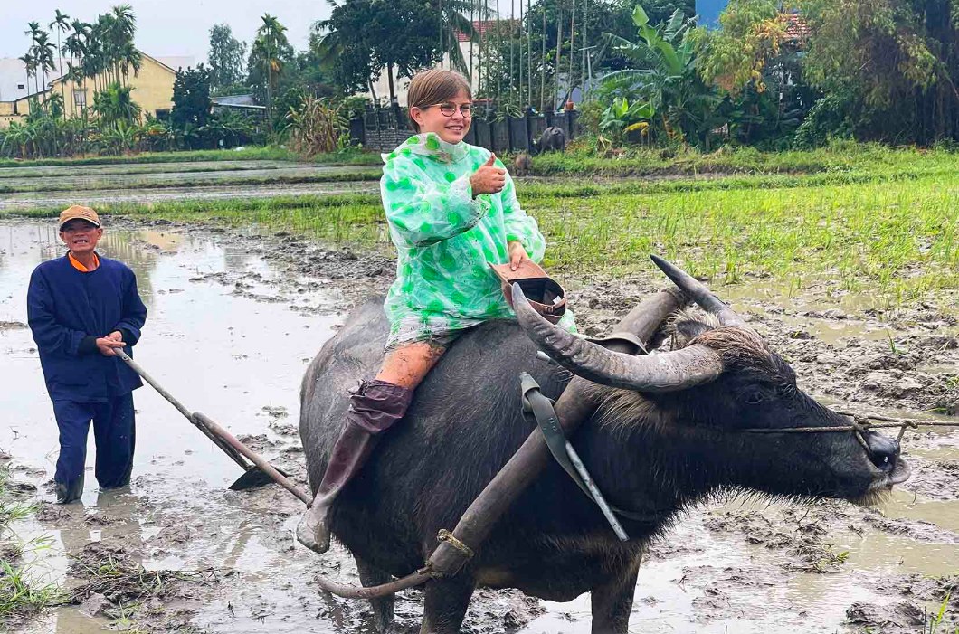Foreign tourists enjoy a day as a farmer in Hoi An
