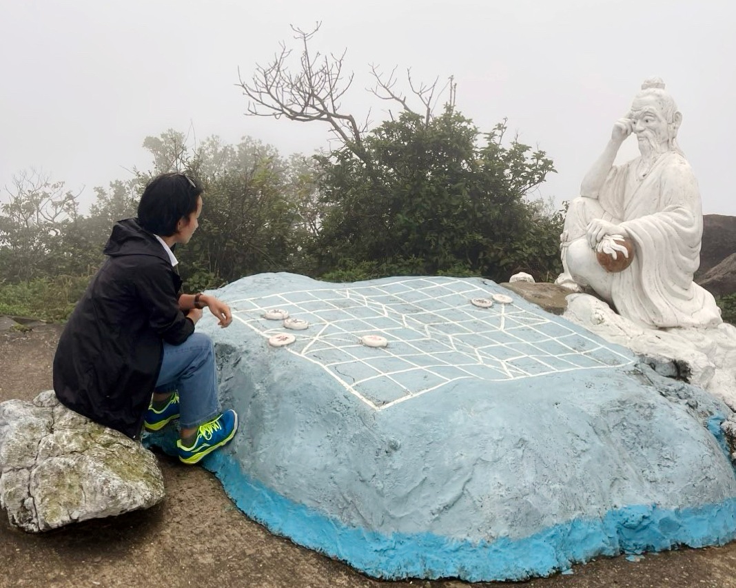 Playing chess at the peak