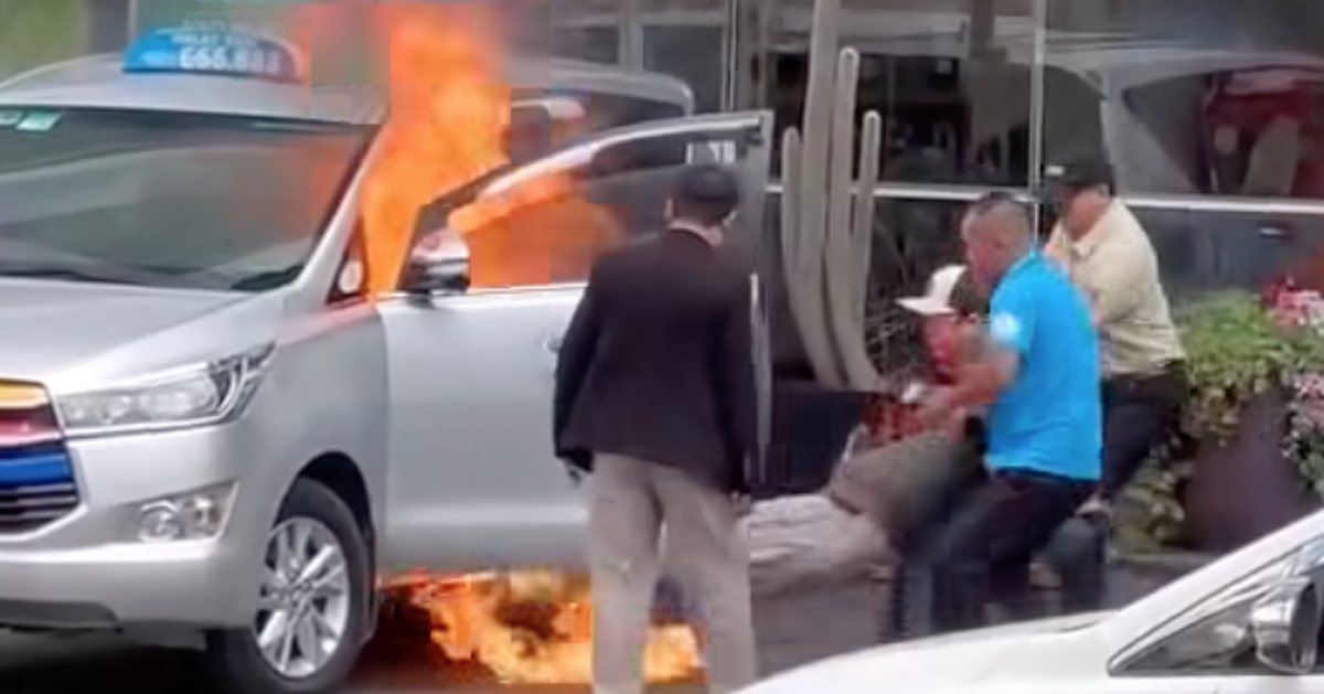 Bảo vệ khách sạn giải cứu tài xế kẹt trong taxi đang bốc cháy