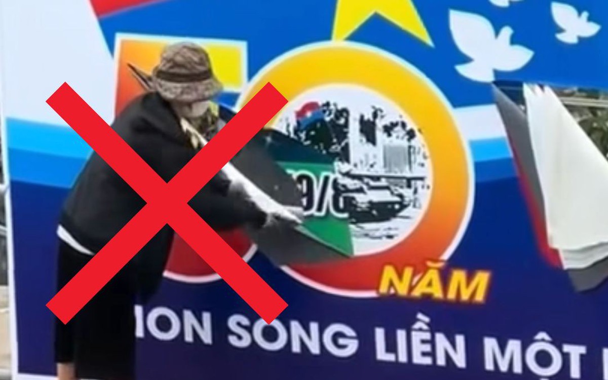 Công an xác minh người phụ nữ ở Hà Nội cầm dao rạch biển pa nô chào mừng ngày thống nhất đất nước