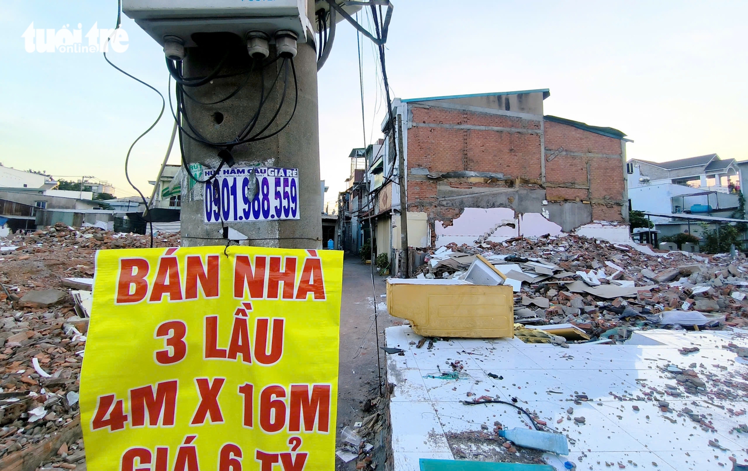 Dọc quốc lộ 13, nhà cửa liên tiếp tháo dỡ để nhường chỗ mở rộng đường - Ảnh 3.