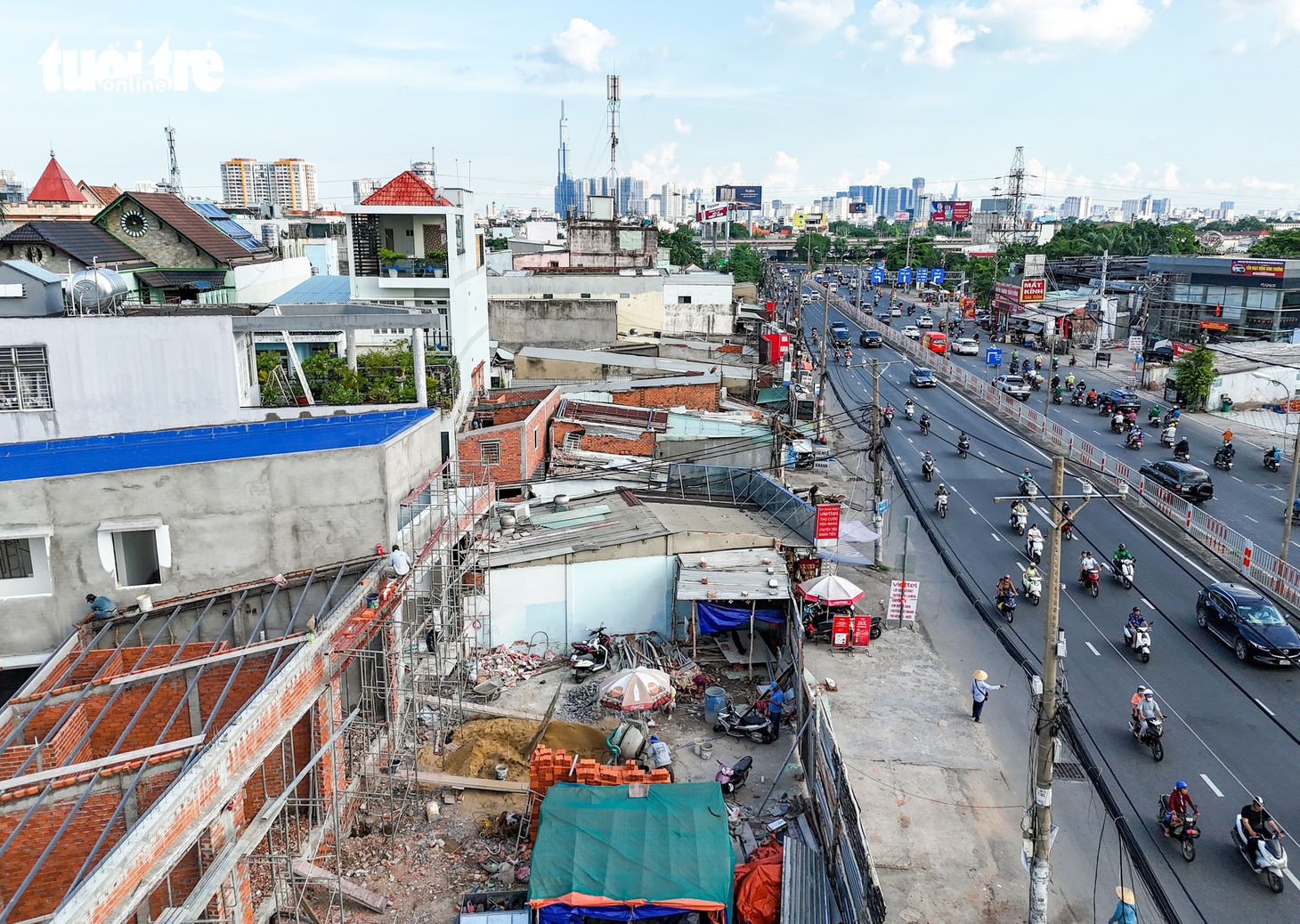 Dọc quốc lộ 13, nhà cửa liên tiếp tháo dỡ để nhường chỗ mở rộng đường - Ảnh 9.