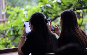 Vietnam warns of rising online scams as Internet use nears 7 hrs a day- Ảnh 3.