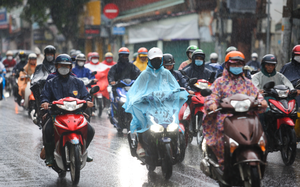 Southern Vietnam braces for more rain, while northern region’s heatwave set to ease- Ảnh 2.