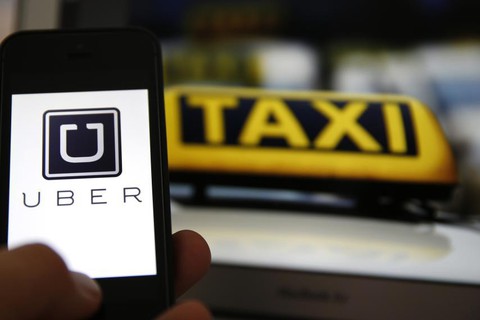 Phải gọi Uber, Grab là taxi đặt xe qua mạng? - Ảnh 1. Phải gọi Uber, Grab là taxi đặt xe qua mạng? - Ảnh 1.