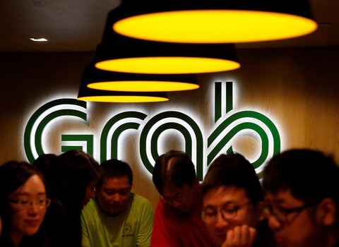 Uber chịu nhường Đông Nam Á cho Grab - Ảnh 1. Uber chịu nhường Đông Nam Á cho Grab - Ảnh 1.