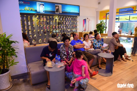 Người Sài Gòn hối hả cập nhật ảnh chân dung thuê bao - Ảnh 16. Người Sài Gòn hối hả cập nhật ảnh chân dung thuê bao - Ảnh 16.