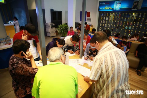 Người Sài Gòn hối hả cập nhật ảnh chân dung thuê bao - Ảnh 5. Người Sài Gòn hối hả cập nhật ảnh chân dung thuê bao - Ảnh 5.