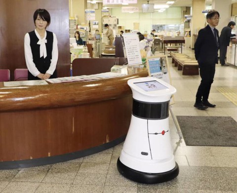 Robot công chức giúp dân làm giấy tờ - Ảnh 1. Robot công chức giúp dân làm giấy tờ - Ảnh 1.