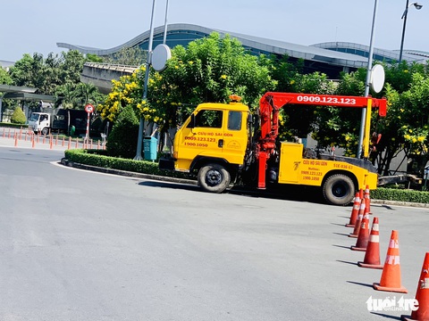 Tân Sơn Nhất nghẹt người đón Việt kiều về ăn Tết nhưng vẫn đều tăm tắp - Ảnh 8. Tân Sơn Nhất nghẹt người đón Việt kiều về ăn Tết nhưng vẫn đều tăm tắp - Ảnh 8.