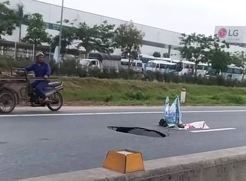 Tài xế thót tim tránh hố tử thần giữa quốc lộ 10 vừa nâng cấp - Ảnh 2. Tài xế thót tim tránh hố tử thần giữa quốc lộ 10 vừa nâng cấp - Ảnh 2.