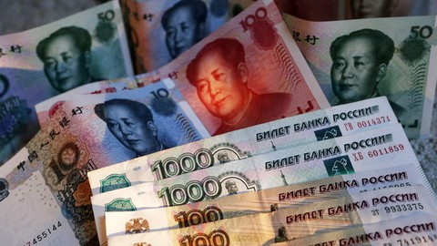 Nga - Trung nhất trí dùng nội tệ giao dịch, giảm lệ thuộc USD - Ảnh 1. Nga - Trung nhất trí dùng nội tệ giao dịch, giảm lệ thuộc USD - Ảnh 1.