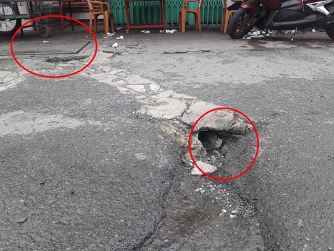Làm đường nham nhở, người dân phải sống chung với ổ gà - Ảnh 1. Làm đường nham nhở, người dân phải sống chung với ổ gà - Ảnh 1.