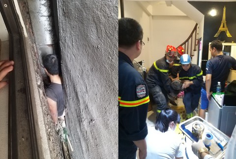 Cảnh sát giải cứu người đàn ông mắc kẹt ở khe hở giữa 3 ngôi nhà - Ảnh 1. Cảnh sát giải cứu người đàn ông mắc kẹt ở khe hở giữa 3 ngôi nhà - Ảnh 1.