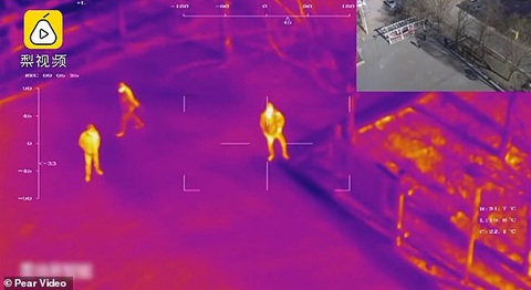 Trung Quốc đưa robot, máy bay không người lái tầm soát người nhiễm COVID-19 - Ảnh 1. Trung Quốc đưa robot, máy bay không người lái tầm soát người nhiễm COVID-19 - Ảnh 1.