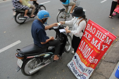Bảo hiểm xe máy: ‘Có vấn đề’ về cách thức triển khai, sửa sai thế nào? - Ảnh 1. Bảo hiểm xe máy: ‘Có vấn đề’ về cách thức triển khai, sửa sai thế nào? - Ảnh 1.