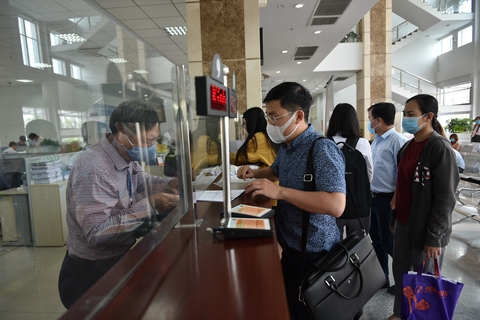 Doanh nghiệp vất vả lo tiền thuế - Ảnh 1. Doanh nghiệp vất vả lo tiền thuế - Ảnh 1.