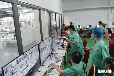 Robot vận chuyển thuốc, thực phẩm, nói chuyện với bệnh nhân ở bệnh viện dã chiến - Ảnh 3. Robot vận chuyển thuốc, thực phẩm, nói chuyện với bệnh nhân ở bệnh viện dã chiến - Ảnh 3.